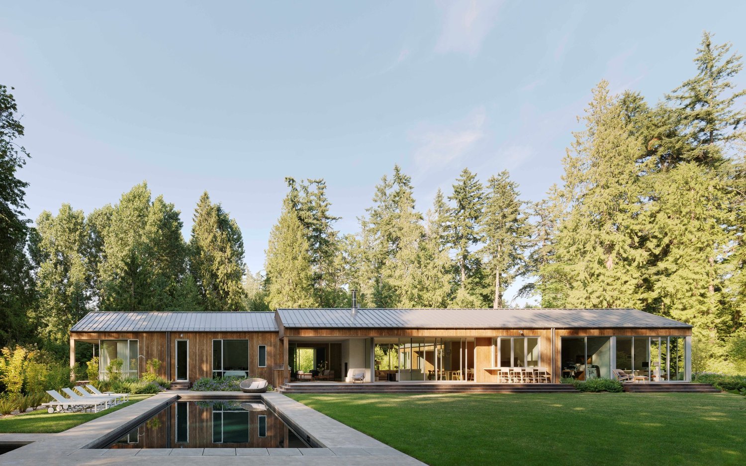 KrisCo portfolio pool with modern patio and water reflections